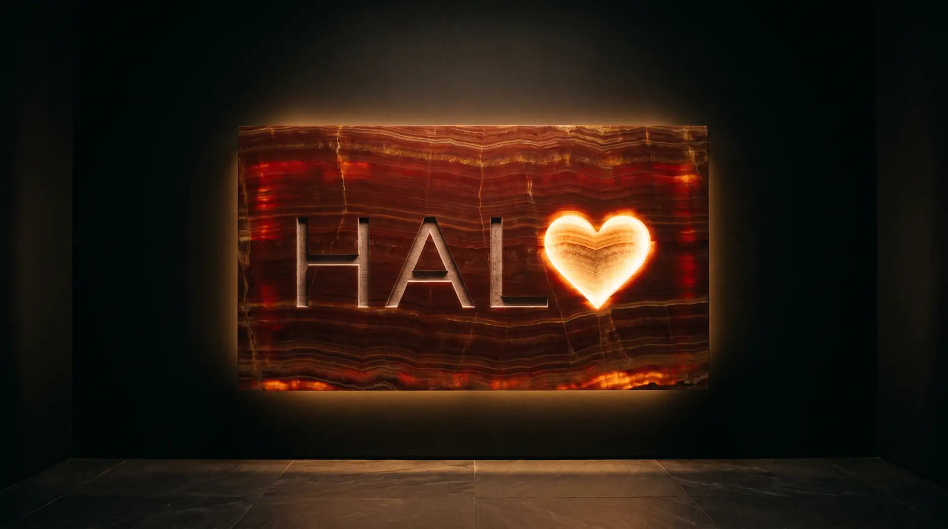Halo spelled on a glowing slab of red marble, the O a heart
